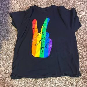 Xl large black and rainbow shirt with a peace hand signal.From spencer’s.